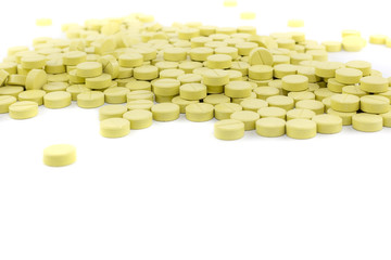 green pills on white floor