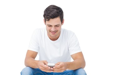 Handsome man texting 