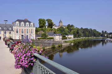 Fototapeta na wymiar Port on Mayenne river at Château-Gontier with the Saint-Jean-Baptiste church in the background, commune in the Mayenne department, Pays de la Loire Region, in north-western France