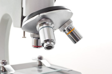 Detail of a microscope on a white background