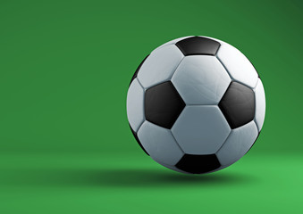 Soccer ball with shadows on green background.