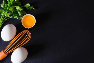 Broken eggs with a whisk. Free space for text