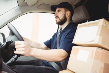 Delivery man driving his van