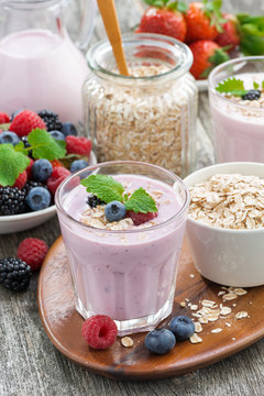 berry smoothie with oatmeal in a glass on table