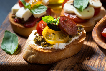 Italian appetizers - various bruschettas, closeup