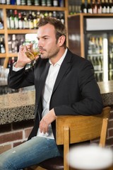 Handsome man having a whiskey