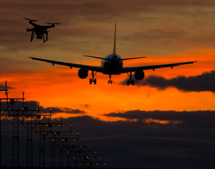Fototapeta na wymiar Drone flying near commercial airplane