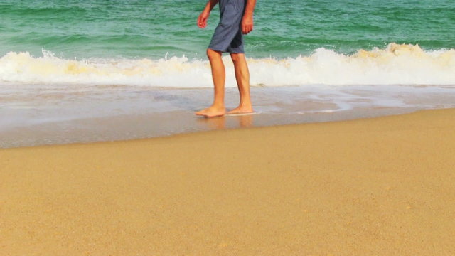 Man Going On The Tropical Beach
