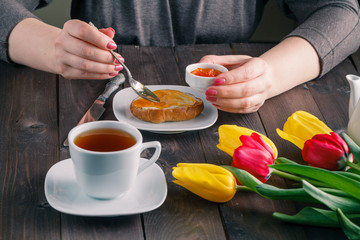Woman eating bread with jam