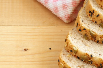 Whole wheat bread on wooden background.copy space