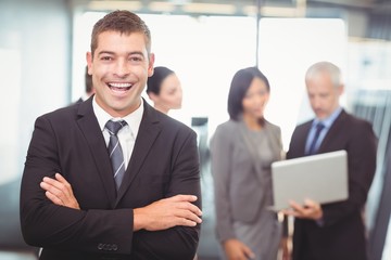 Businessman standing with arms crossed