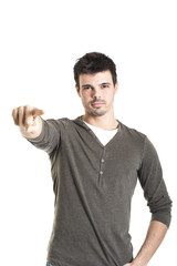 Naklejka premium Young man pointing over isolated white background