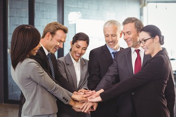 Businesspeople hands stacked over each other