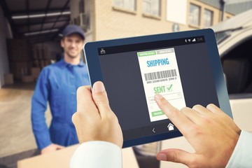 Composite image of man using tablet pc