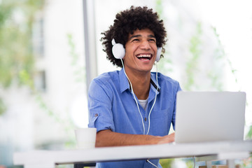 Afro man using laptop 