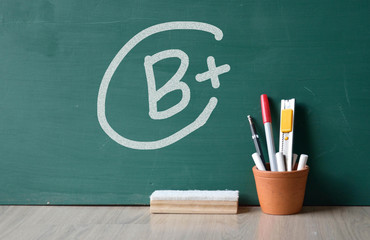 chalk drawing b plus grade mark