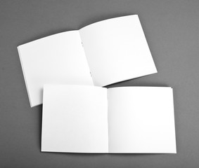 Blank opened magazine isolated on grey background with soft shadow
