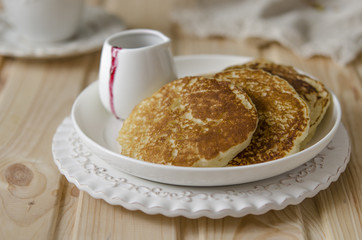Pancake with jam from the black currant for a breakfast   
