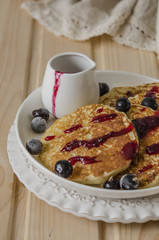 Pancake with jam from the black currant for a breakfast   