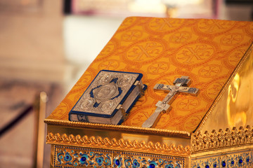 altar of Christian church both Holy Bible and gold cross
