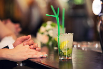 loving couple and cocktail of a mojito