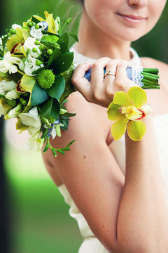Bridal bouquet of yellow-green bracelet from a green orchid