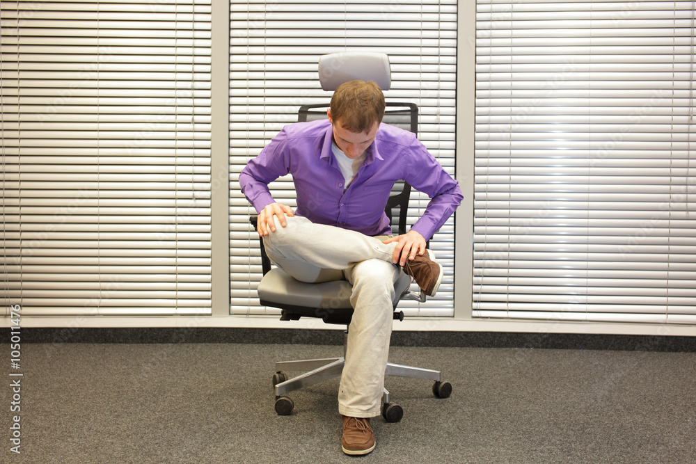 Wall mural man exercising on chair in office, healthy lifestyle - front 