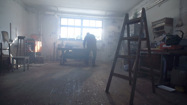 Man standing at the window in the shop