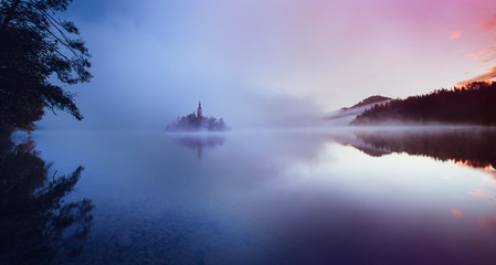 Famous island with old church in the city of Bled. - 105012478