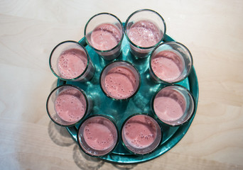 Naklejka premium strawberry smoothie on a tray