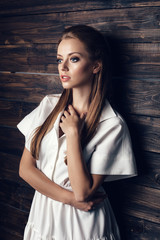 Fashion young beautiful woman in white dress