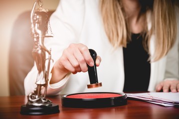 Woman Notary Public stamping the Power of attorney