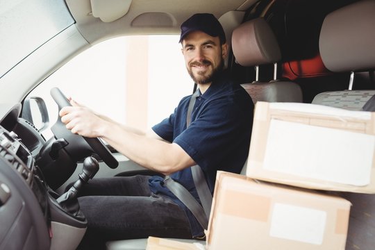 Delivery man driving his van