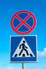 road sign stop forbidden and pedestrians on sky background