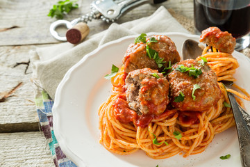 Meat balls and spaghetti on white plate