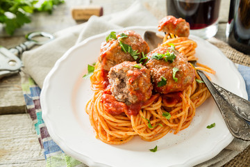 Meat balls and spaghetti on white plate