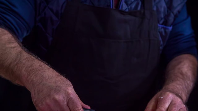 Sharpening a knife and then cutting meat