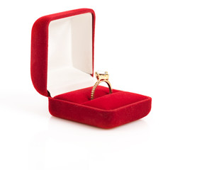 wedding rings in a gift box on white background
