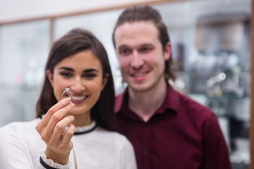 Couple looking at finger ring