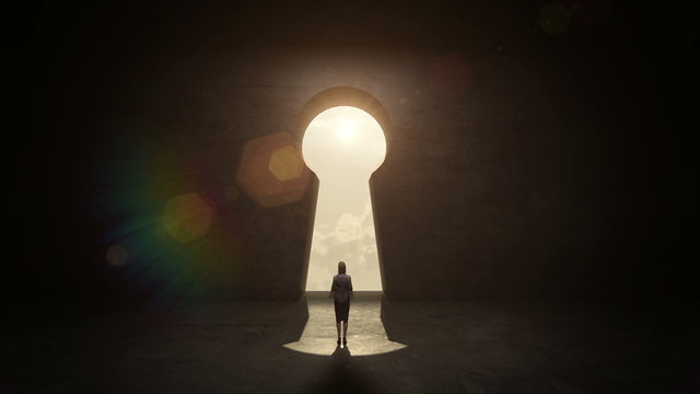 businesswoman Standing in front of Keyhole, black wall concept.