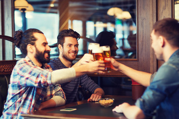 happy male friends drinking beer at bar or pub