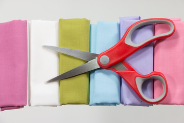  Scissors are used for cutting various thin materials on white b