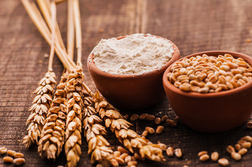 Photo  of  fresh wheat grains and flour