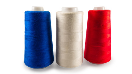 Spools of sewing threads on white background