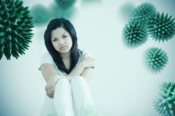 Composite image of barefoot woman sitting on the floor 