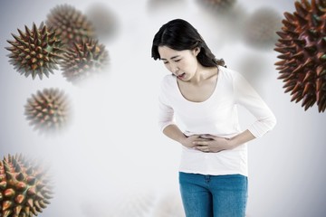 Composite image of young woman with stomach pain 