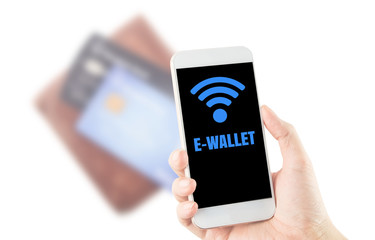 smartphone in hand word e-wallet wi-fi icon on blurred wallet and credit card background