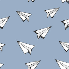 Seamless pattern with a white paper airplane on blue background . Drawing by hand . Line drawing. Doodle airplane
