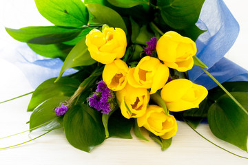 Bouquet of yellow tulips as a gift on Valentine's Day, on March
