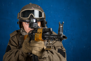 Soldier aiming a rifle